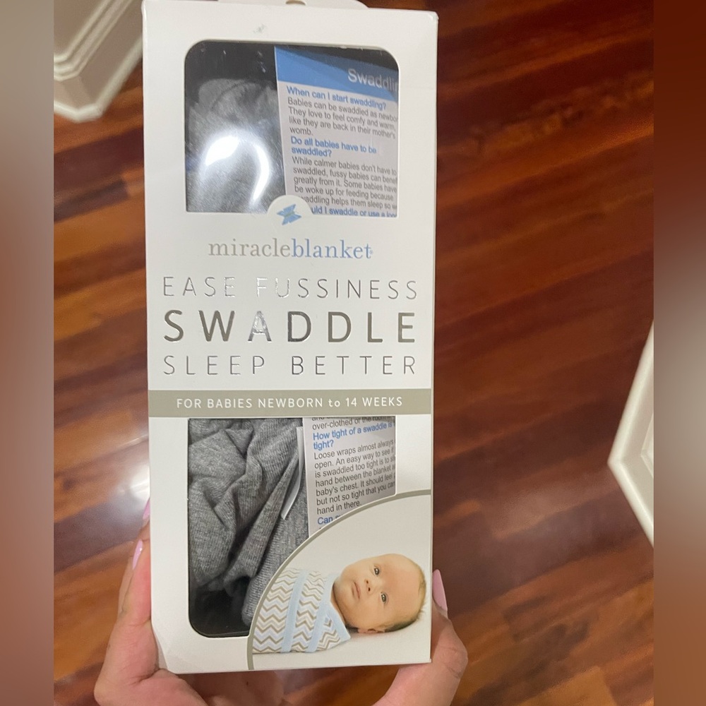 Miracle blanket swaddle never used but opened the box.